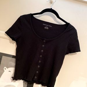 Basic black ribbed button down t-shirt with lettuce cut buttom